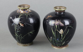 A pair of black ground cloisonne globular shaped vases decorated birds on branches 9cm h 