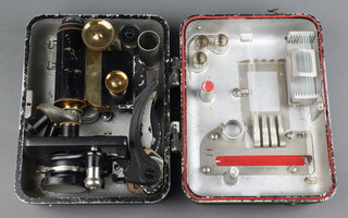 Spencer Lens Company Buffalo New York, a folding field microscope in a metal carrying case 