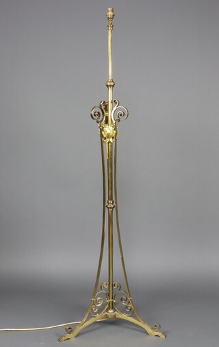 A 19th Century  gilt metal standard oil lamp converted to an electric standard lamp, raised on gilt metal supports 147cm h x 53cm 