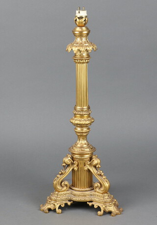 A gilt metal Rococo style table lamp with fluted column, raised on a platform base 47cm h x 20cm 