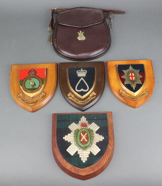 A Military Issue leather sporran with Black Watch badge to the front marked B.H.G 1949 254, 4 military wall plaques - Coldstream Guards, Black Watch, Northern Rhodesia Regt. and 5th Battalion The Kings African Rifles 