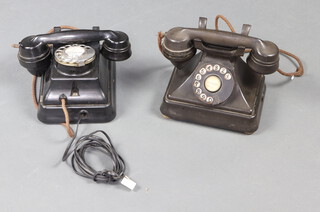 A Siemens Brothers black Bakelite wall telephone, together with a black Bakelite dial telephone (large chip to base), both receivers PAT 328926