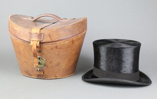 Scott and Company, a gentleman's black top hat, size 6 3/4, complete with leather carrying case, the carrying case has a damaged hinge 