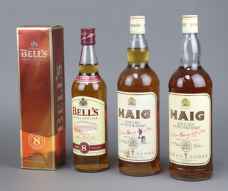 Two litre bottles of Haig Fine Old Scotts Whisky, a 70cl bottle of Bells 8 year old Scotts Whisky 