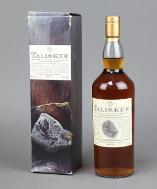 A litre bottle of Talisker Aged 10 Years Old malt Whisky, with cardboard box (this is a discontinued 10 year old from the Skye distillery Talisker)