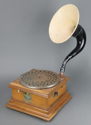 A manual horn gramophone with oak case and associated horn, the base labelled Les Disques Pathe Chantent Sans Aiguille, Marque de Fabrique depose 15cm h x 30cm w x 31cm d  