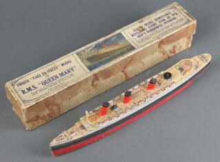 A Unique Take a Piece model of RMS Queen Mary together with key chart, boxed