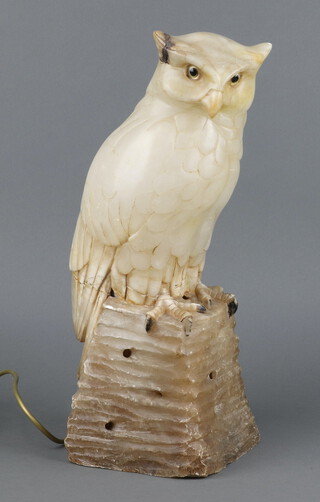 A carved alabaster table lamp in the form of an owl 45cm h x 16cm w x 14cm d 