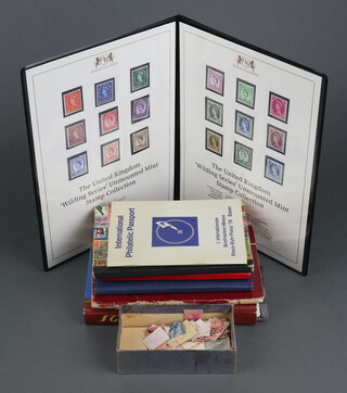 Harrington and Byrne, United Kingdom "Wilding Series" unmounted mint stamp collection contained in a folder, 4 small stock books of GB and world stamps Victorian and later and a small red album of world stamps 