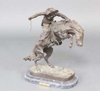 After Frederic Remington, a bronze figure "Bronco Buster" 61cm h x 50cm w x 28cm d, raised on an oval black veined marble base, with possible replacement reins 