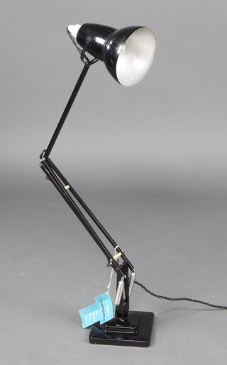 Herbert Terry, a black anglepoise lamp raised on a stepped base together with original paper instruction card  76cm x 15cm (for decorative purposes only)