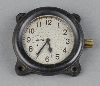 An aircraft clock, the 5.5cm silvered dial with subsidiary second hand marked 5830, contained in a black plastic case, the reverse marked 3U3 within a triangle, labelled Moved from Dornier, shot down Rotherfield, crashed opposite Sheriff's Lane Cottages