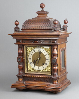 R M S, a 19th Century German Ting Tang bracket clock, the 16cm gilt dial with gilt and silvered chapter ring, Roman numerals, contained in a carved walnut case with finials to the top 50cm h x 30cm w x 20cm d, complete with pendulum and key