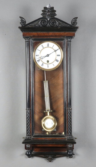 A regulator style timepiece with 13cm enamelled dial, Roman numerals, having a grid iron pendulum and contained in a walnut and ebonised case 77cm h x 26cm w x 15cm d, complete with pendulum and key 