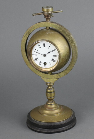 A 19th Century desk clock barometer,  the top set a compass with 7cm enamelled dial, Roman numerals, 1 side set an aneroid barometer with porcelain dial, all contained with a gilt metal gimbal frame 27cm h x 12cm diam.  