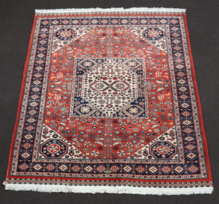 An orange blue and white ground Persian rug with square central medallion 209cm  x 171cm 