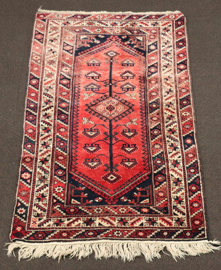 A blue and red ground Belouche rug with stylised tree of life and 2 central medallions within a multi row border 197cm  x 121cm 