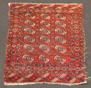 A red and white blue ground Bokhara rug with 18 octagons to the centre 130cm x 110cm 