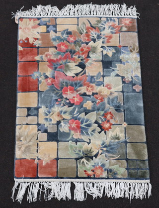 A Chinese silk floral patterned rug 92cm x 61cm 