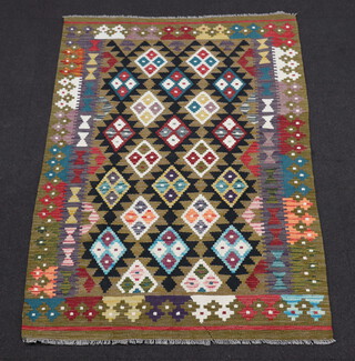 A black and green ground Maimana Kilim rug with all over diamond design 193cm x 129cm 