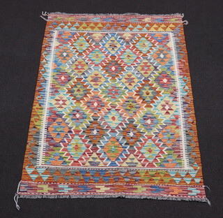 A yellow, green and turquoise ground Chobi Kilim rug with all over geometric designs 190cm x 129cm 