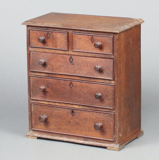 A 19th Century  oak pedestal chest of 2 short and 3 long drawers with inlaid faux escutcheons raised on bracket feet 41cm h x 38cm w x 20cm d 