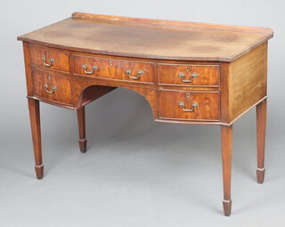 A 19th Century  mahogany bow front wash stand/writing table with raised back fitted 1 long and 2 short drawers, raised on square tapered supports, spade feet 79cm h x 116cm w x 57cm d 