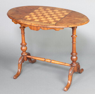A Victorian oval inlaid walnut stretcher table, the top inlaid a chessboard raised on turned supports with H framed stretcher 65cm h x 85cm w x 50cm d