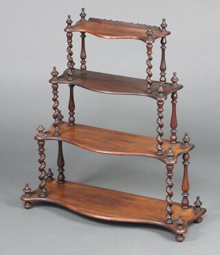 A Victorian rosewood 3 tier hanging wall shelf of serpentine outline, raised on spiral turned supports 74cm h x 66cm w x 22cm d 