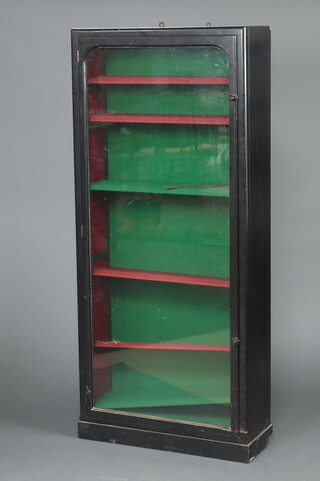 A Victorian ebonised display cabinet, fitted shelves enclosed by a glazed panelled door 178 cm h x 79cm w x 28cm d