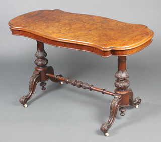 A Victorian figured walnut stretcher table of serpentine outline, raised on bulbous turned supports with H framed stretcher 73cm h x 121cm w x 66cm d 