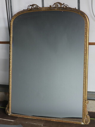 A Victorian arched plate over mantel mirror contained in a decorative gilt wood and plaster frame 186cm x 147cm 