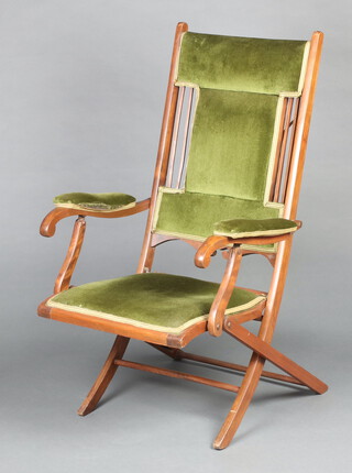 An Edwardian mahogany folding campaign chair upholstered in green material 109cm x 63cm x 61cm (seat 30cm x 32cm)