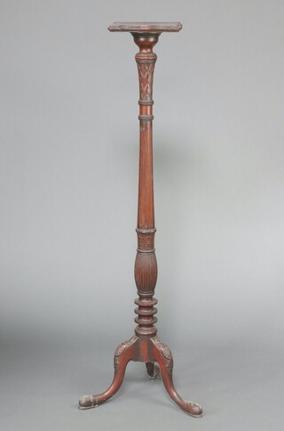 A William IV turned and fluted mahogany torchere with square top, raised on a platform base 152cm h x 27cm 