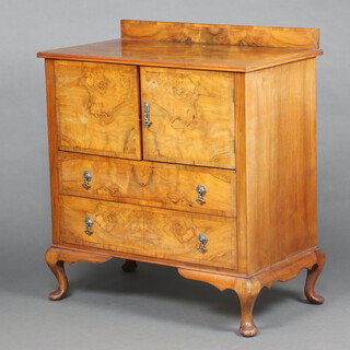 A 1920's Queen Anne style figured walnut tallboy with raised back with 3/4 veneered top above cupboard enclosed by panelled doors, the base fitted 2 drawers, raised on cabriole supports 101cm h x 92cm w x 51cm d  