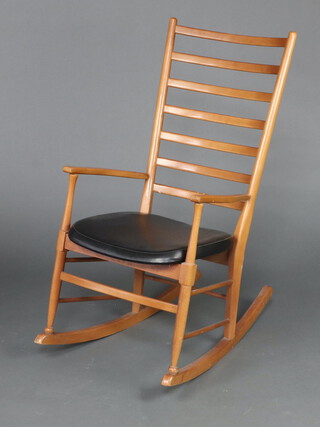 A mid-Century beech ladder back rocking chair 101cm h x 51cm w x 76cm d 