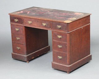 A Victorian mahogany desk with red in set writing surface above  1 long and 6 short drawers 73cm h x 107cm w x 58cm d (leather to top needs replacing, drawer stops have gone to 4 of the drawers in the pedestal, 1 caster missing) 
