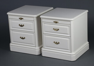 Olympus, a pair of white laminate bedside chests with bushing slide and 2 drawers 55cm h x 46cm w x 47cm d 