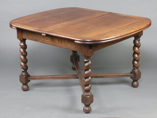 An oak drawleaf dining table raised on spiral turned supports with X framed stretcher 74cm h x 122cm w x 106cm d 