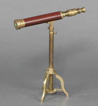 A 19th Century style brass telescope and tripod 43cm h x 38cm w 
