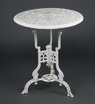 A white painted Victorian style pierced aluminium circular garden table raised on outswept supports 68cm h x 61cm diam. 
