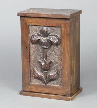 An Edwardian carved mahogany cabinet enclosed by a panelled  door 34cm h x 22cm w x 15cm d (water marks and contact marks in places)