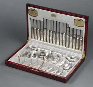 A Viners canteen of silver plated flatware contained in a mahogany finished canteen 