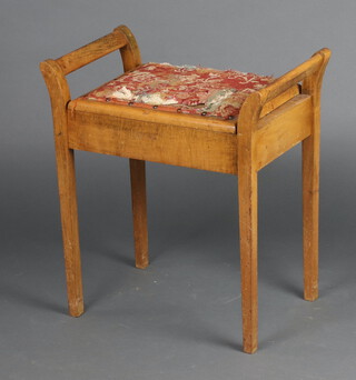 A boxed seat piano stool with hinged lid, raised on square tapered supports 59cm h x 52m w x 33cm d 