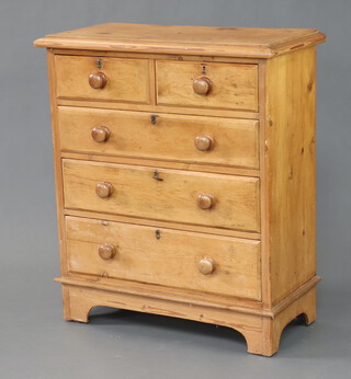 A Victorian style pine chest of 2 short and 3 long graduated drawers with turned handles, raised on bracket feet 108cm h x 89cm w x 44cm d (contact marks in places)