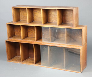 An oak Minty style 3 tier bookcase 38cm h x 135cm w x 28cm d (water and contact marks in places)