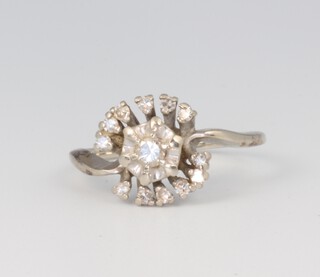 A white metal illusion diamond set dress ring, size M, 2.8 grams 