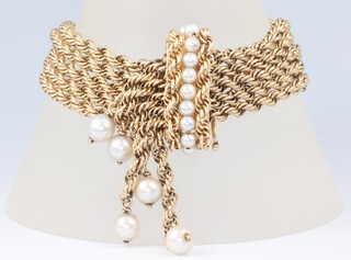 A yellow metal marked 14K rope twist bracelet set pearls, 44.9 grams, max length 23cm