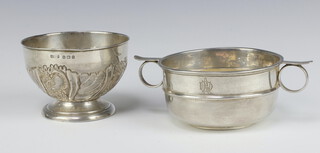 An Edwardian embossed silver sugar bowl  Birmingham 1906 together with a silver twin handled bowl London 1907, both with inscriptions, 213 grams 