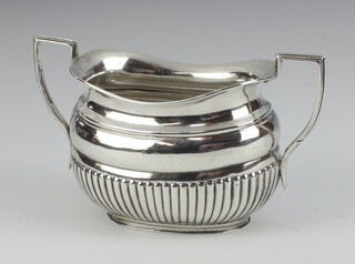 A Victorian silver twin handled sugar bowl with demi-reeded decoration London 1892, 146 grams 